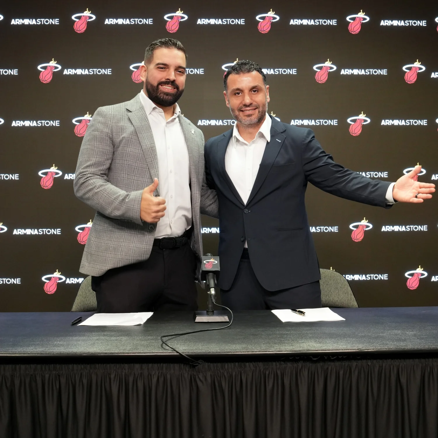Emre Basman of Armina Stone with Miami Heat representative Anthony Perez at partnership signing